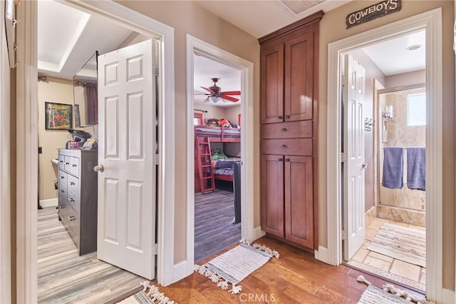 hallway with light wood-type flooring