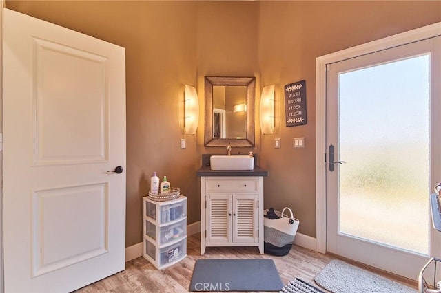 bathroom featuring vanity and hardwood / wood-style floors