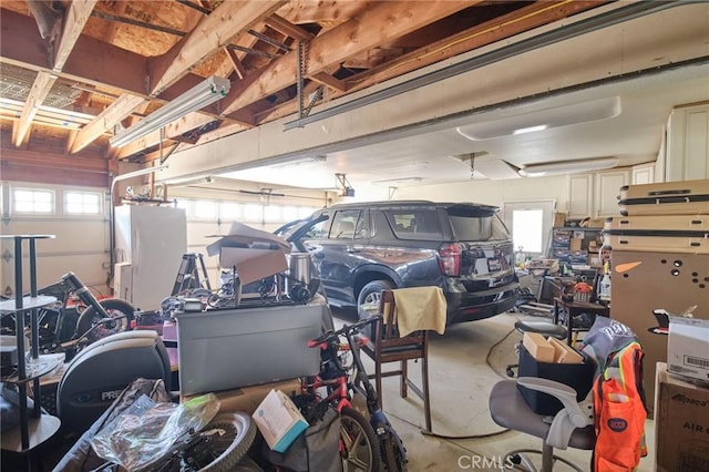 garage featuring white fridge