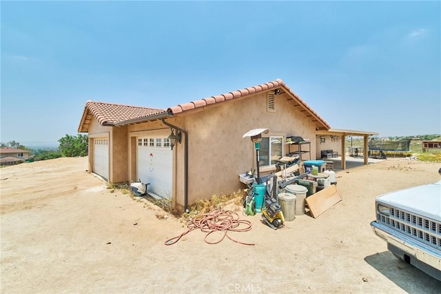 view of side of property with a garage