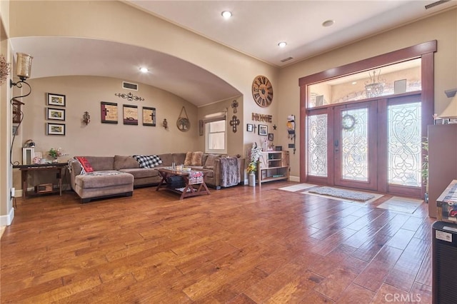 living room featuring hardwood / wood-style flooring and french doors