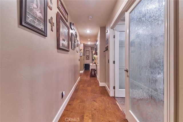 corridor featuring hardwood / wood-style flooring