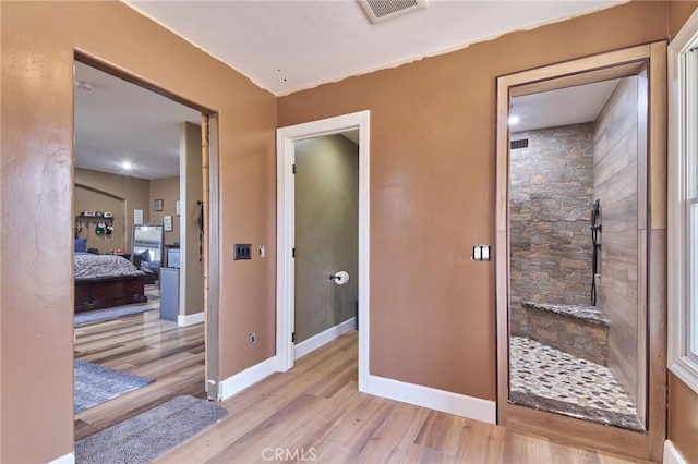 hallway featuring light hardwood / wood-style flooring