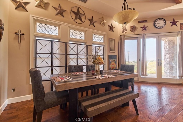 dining room featuring french doors and wood-type flooring