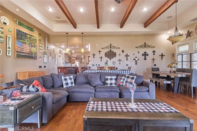 living room with hardwood / wood-style floors and beam ceiling