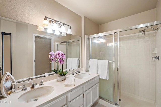 bathroom with an enclosed shower and vanity