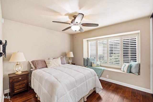 bedroom with ceiling fan and dark hardwood / wood-style flooring