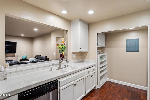 kitchen with sink, dishwasher, white cabinetry, electric panel, and tile counters