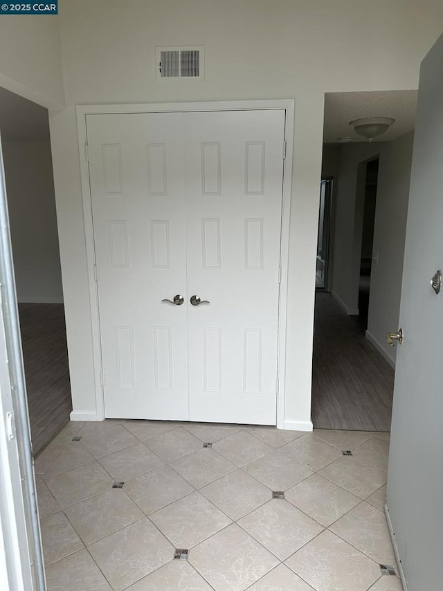 interior space featuring light tile patterned floors