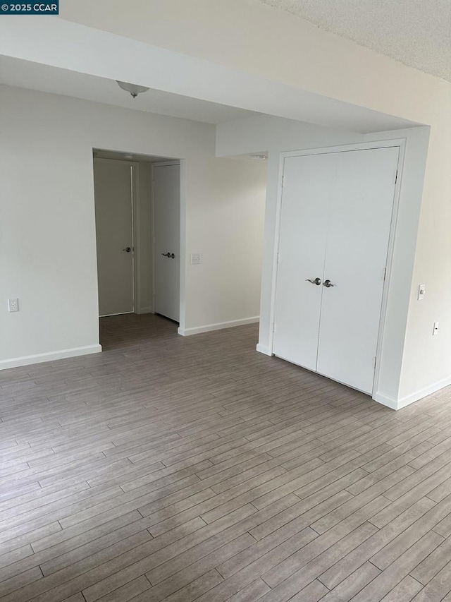 spare room featuring light hardwood / wood-style flooring