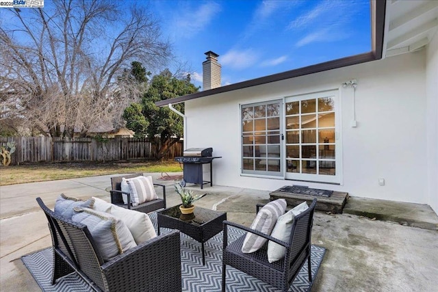 view of patio / terrace featuring an outdoor living space and a grill