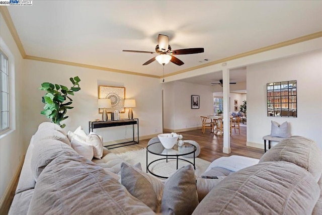 living room featuring crown molding, ceiling fan, and light hardwood / wood-style flooring