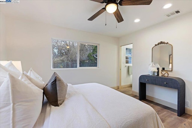 bedroom with ceiling fan and wood-type flooring