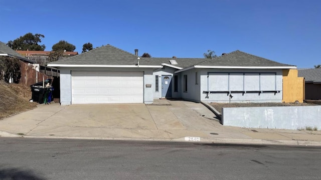 ranch-style home featuring a garage