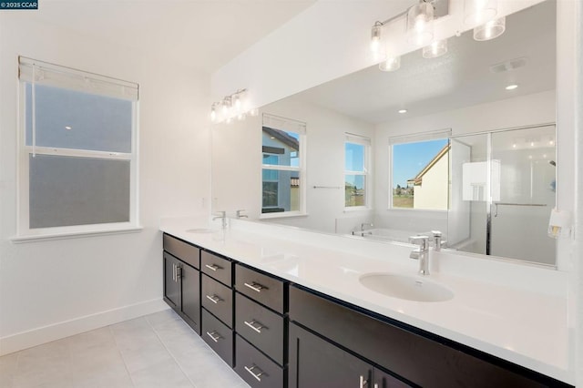 bathroom featuring vanity, tile patterned floors, and separate shower and tub