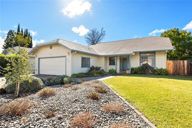 ranch-style house with a garage and a front yard