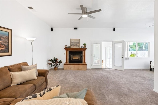 carpeted living room featuring ceiling fan