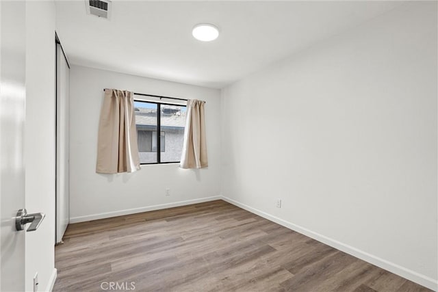 empty room featuring light hardwood / wood-style floors