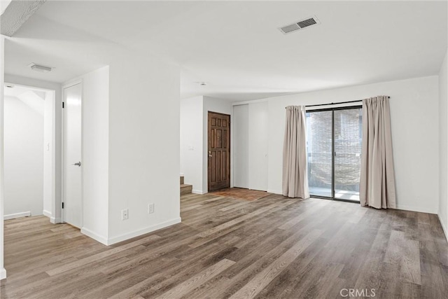 unfurnished room featuring light hardwood / wood-style flooring