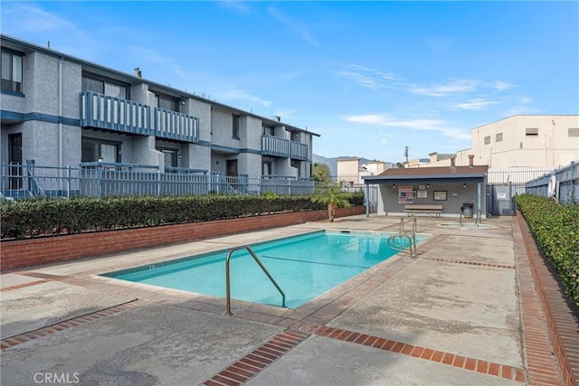 view of swimming pool with a patio area