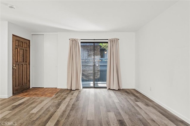 spare room featuring light hardwood / wood-style flooring