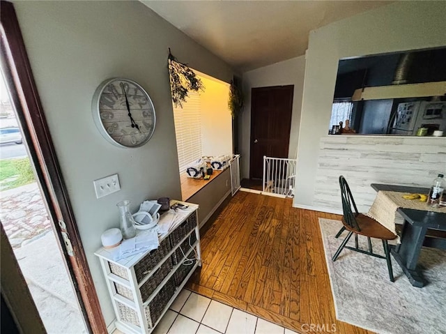 interior space featuring lofted ceiling and hardwood / wood-style flooring