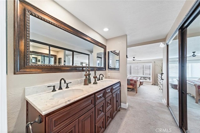 bathroom with vanity, plenty of natural light, and ceiling fan