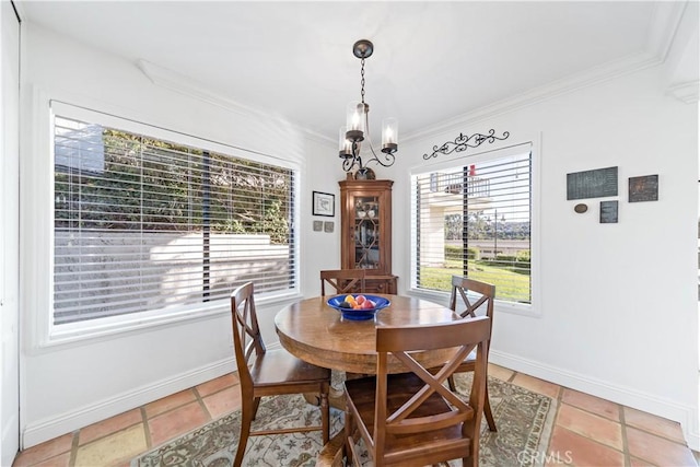 tiled dining room with a notable chandelier and crown molding