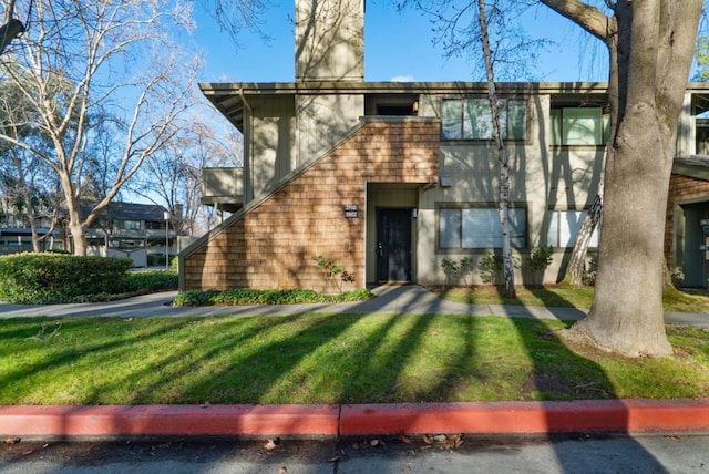 exterior space with a front yard