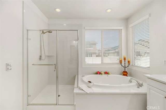 37845 Apache Plume Dr, Murrieta, CA 92563 - bathroom featuring vanity, a stall shower, a garden tub, healthy amount of natural light, and recessed lighting