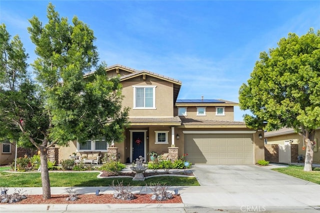 37845 Apache Plume Dr, Murrieta, CA 92563 - view of front of house featuring stucco siding, concrete driveway, solar panels, an attached garage, and a tiled roof