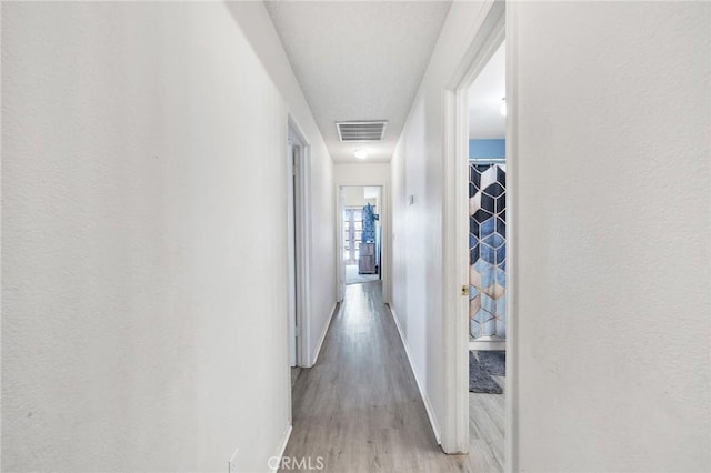 hallway featuring light hardwood / wood-style floors