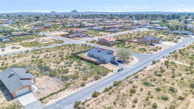 drone / aerial view featuring a mountain view