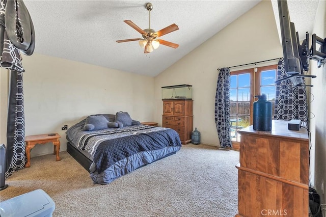 bedroom featuring ceiling fan, vaulted ceiling, a textured ceiling, and carpet flooring