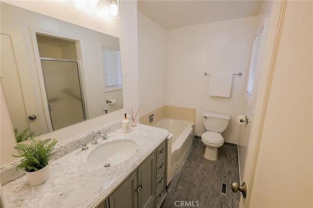 full bathroom featuring vanity, plus walk in shower, and toilet