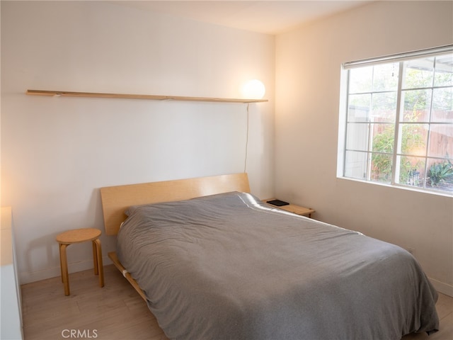 bedroom featuring light hardwood / wood-style floors