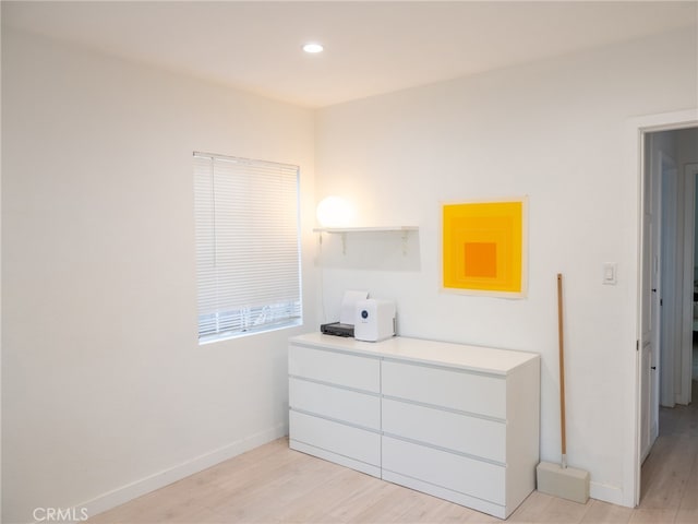 bedroom with light hardwood / wood-style flooring