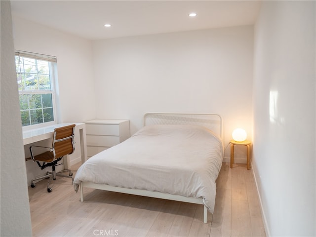 bedroom with light hardwood / wood-style flooring