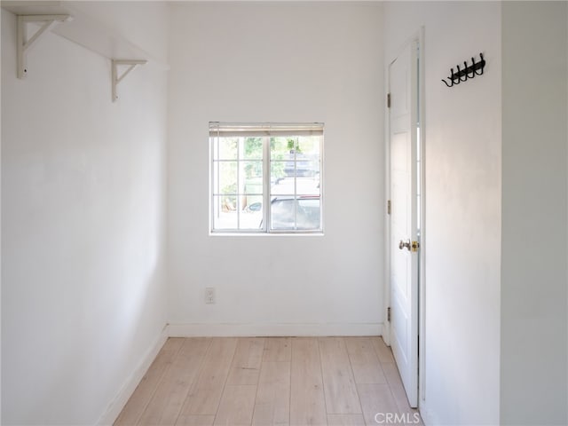 unfurnished room with light hardwood / wood-style floors