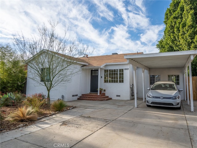 view of front facade with a carport