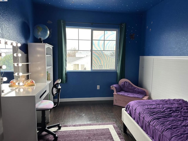 bedroom featuring dark hardwood / wood-style flooring