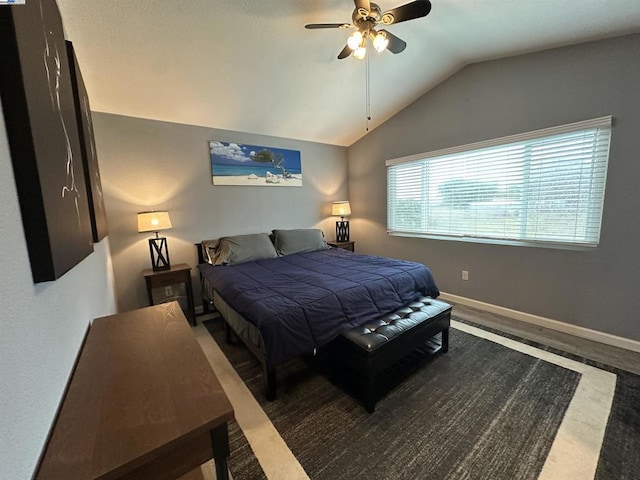 bedroom with ceiling fan and lofted ceiling