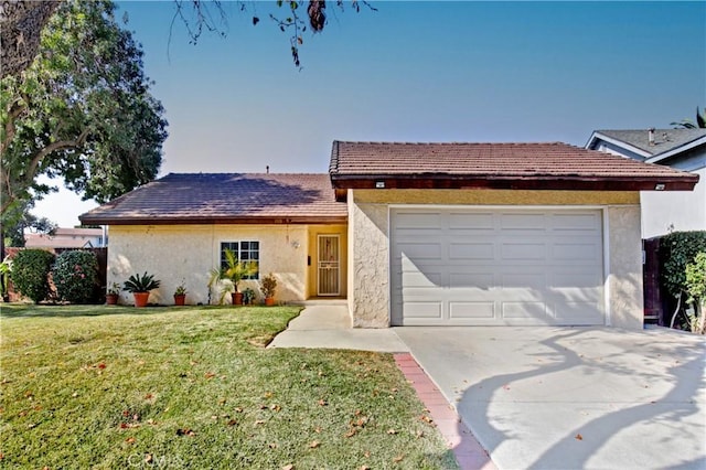 single story home featuring a garage and a front yard