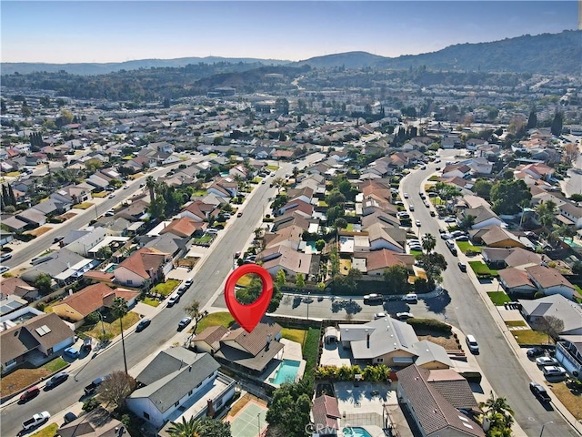 birds eye view of property featuring a mountain view