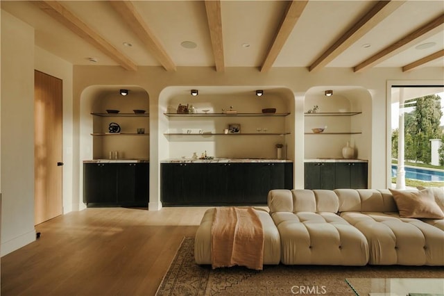 bar featuring beam ceiling, hardwood / wood-style flooring, and built in features