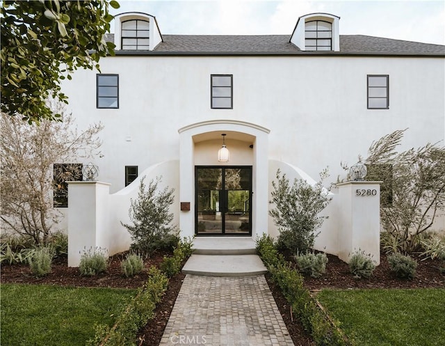 property entrance featuring french doors