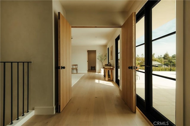 hallway with light wood-type flooring