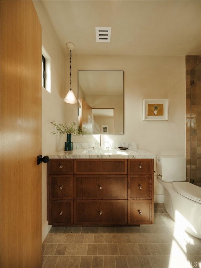 bathroom with vanity and toilet