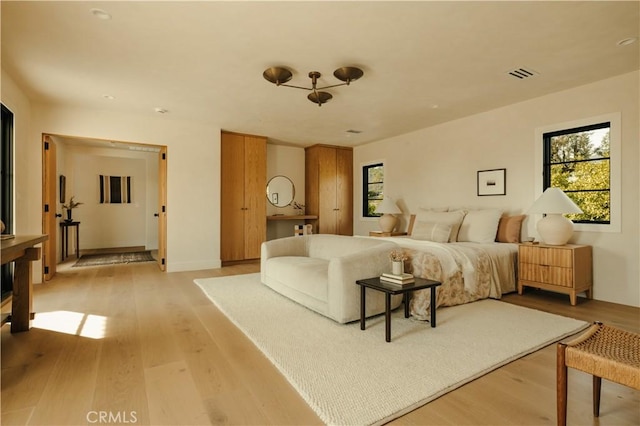 bedroom with light hardwood / wood-style floors