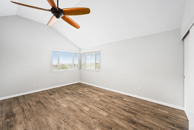 empty room featuring lofted ceiling, wood-type flooring, and ceiling fan